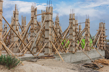 Building a house on the shore of the Black Sea, the use of planks as formwork when pouring columns