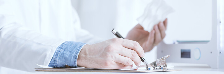 Scientist writing notes