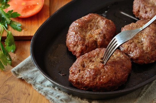Meat cutlets in  cast iron skillet