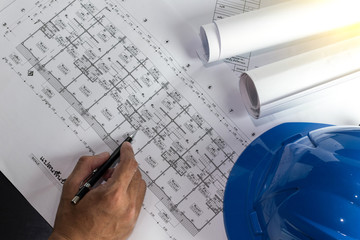 Workplace of architect - Architect rolls and plans.architectural plan,technical project drawing. Engineering tools view from the top. Construction background