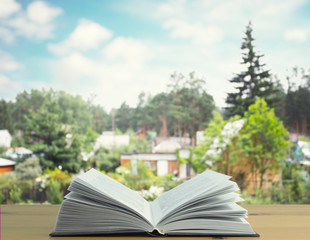book table with countryside background