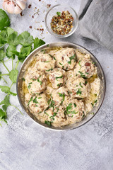 Meatballs with white sauce and parsley