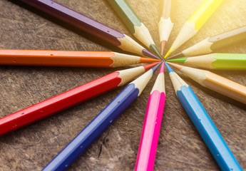 Color pencils on wood background