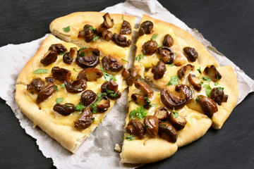 Sliced pizza with mushrooms and cheese