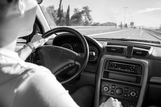 Guy Driving On Open Road ( View From Interior )