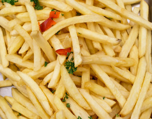 French fried background. Closeup shot. Potato snack.   