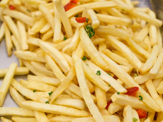 French fried background. Closeup shot. Potato snack.   