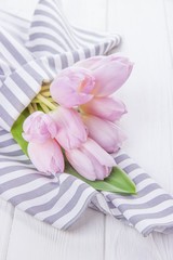 Spring flowers tulips and striped napkin