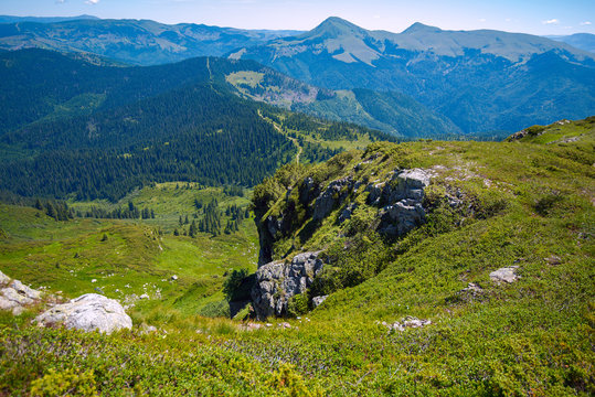 Panorama of green mountains against the blue sky