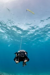 Fotobehang SCUBA diver on a closed circuit rebreather © whitcomberd