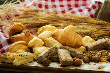 Bakery product assortment with bread loaves, buns, rolls and Danish pastries