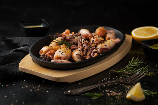 Grilled squid in breadcrumbs with lemon and spices