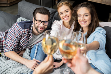 Friends cheering with wine