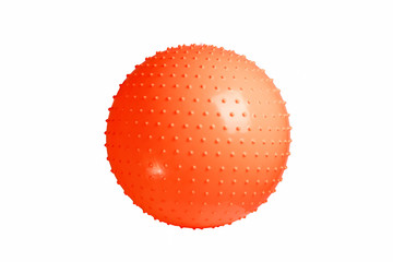 Close up of an orange fitness ball isolated on white background