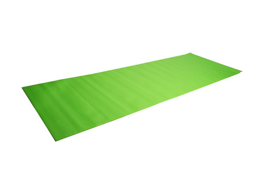 green yoga mat on a white background