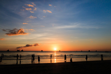 Fototapeta na wymiar Silhouettes and a tropical ocean sunset