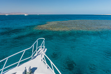 Fototapeta premium View at the coral sea from white yacht