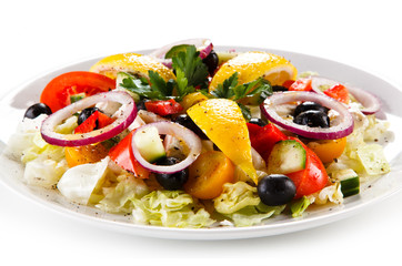Greek salad on white background