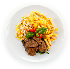 Roasted steak with french fries and vegetable salad