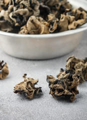 Dry black Chinese mushrooms. Ears. Traditional a popular ingredient for cooking Oriental and Asian cuisine. Selective focus