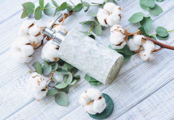 Still life with soap jar eucalyptus branches and cotton flowers for beauty treatment, top view