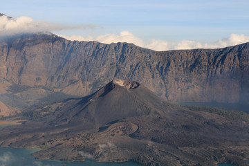 Fototapeta na wymiar Gunung Barujari active volcanic cone in the Segara Anak crater lake 2000ft below
