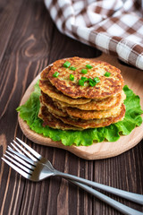 Fried potato pancakes on wooden background