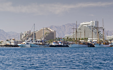 Moored pleasure boats, sailboats and yachts in marina of Eilat - famous resort and recreation city in Israel