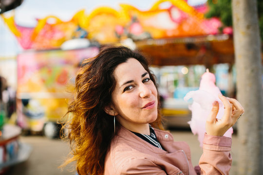 Woman with cotton candy in the park