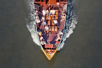 Boat deck with tourists, top view.