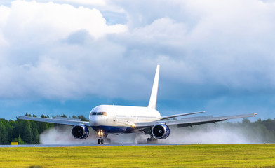 Fototapeta na wymiar Airplane takes off at the airport rain splashes bad weather