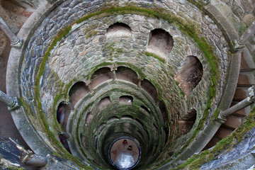 View downwards from the top of the Initiation well in Quinta da Regaleira. Unfinished Well. Inverted tower.
