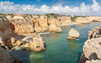 Fototapeta na wymiar Algarve coast with bays and caves, South Portugal. Turquoise ocean water.