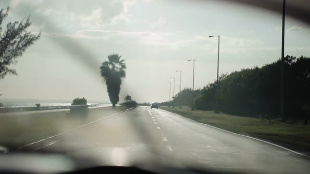 Car driving on highway at sunny day