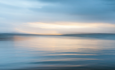 Naklejka na ściany i meble Mystical motion blur background at sunset over the bay Russell New Zealand.