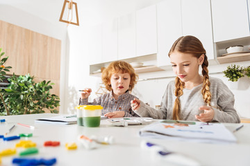 Active determined children deciding on what to draw next