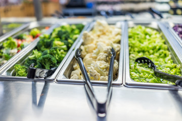 Broccoli, cauliflower and celery in salad bar counter