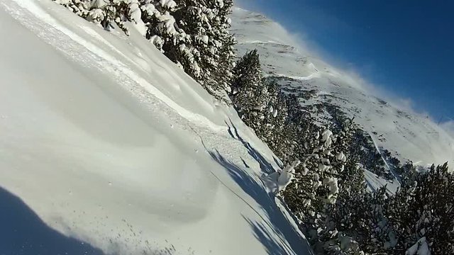 POV of snowboarder enjoying extreme free ride, falling down in snowy forest