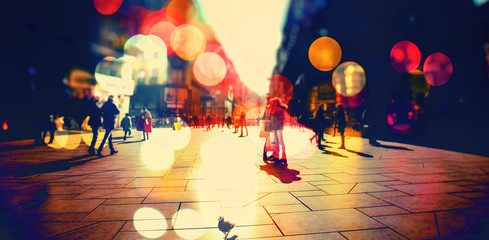 crowd of people walking on the city streets