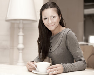  female holding a mug of coffee 