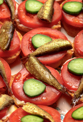 Sprats sandwich with tomato and cucumber