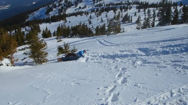 Dangerous fail of amateur snowboarder during extreme trick, risk of spine injury