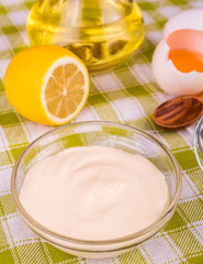 Fototapeta na wymiar Mayonnaise on a bright background. Ingredients mayonnaise