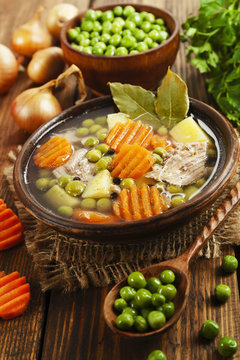 Soup with green peas and meat