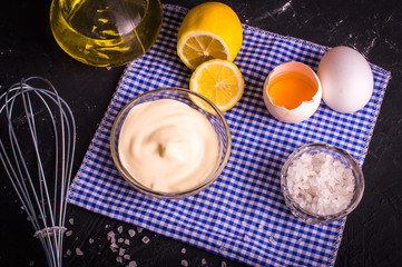 Mayonnaise on a dark background. Ingredients mayonnaise