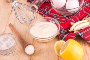 Mayonnaise on a wooden background. Ingredients mayonnaise