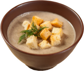 soup puree with croutons and herbs on white background