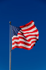 Obraz premium American Flag against blue sky