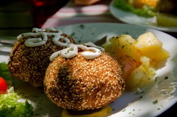Meat Balls with Dressing in the White Plate served on the table