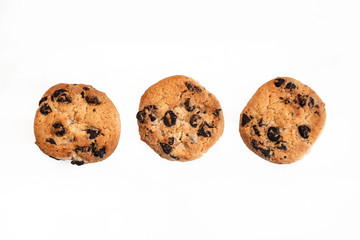 Three classic chocolate chip cookies isolated on white background.